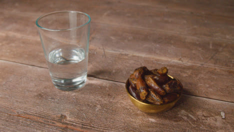Handheld-Shot-of-Dates-and-Water